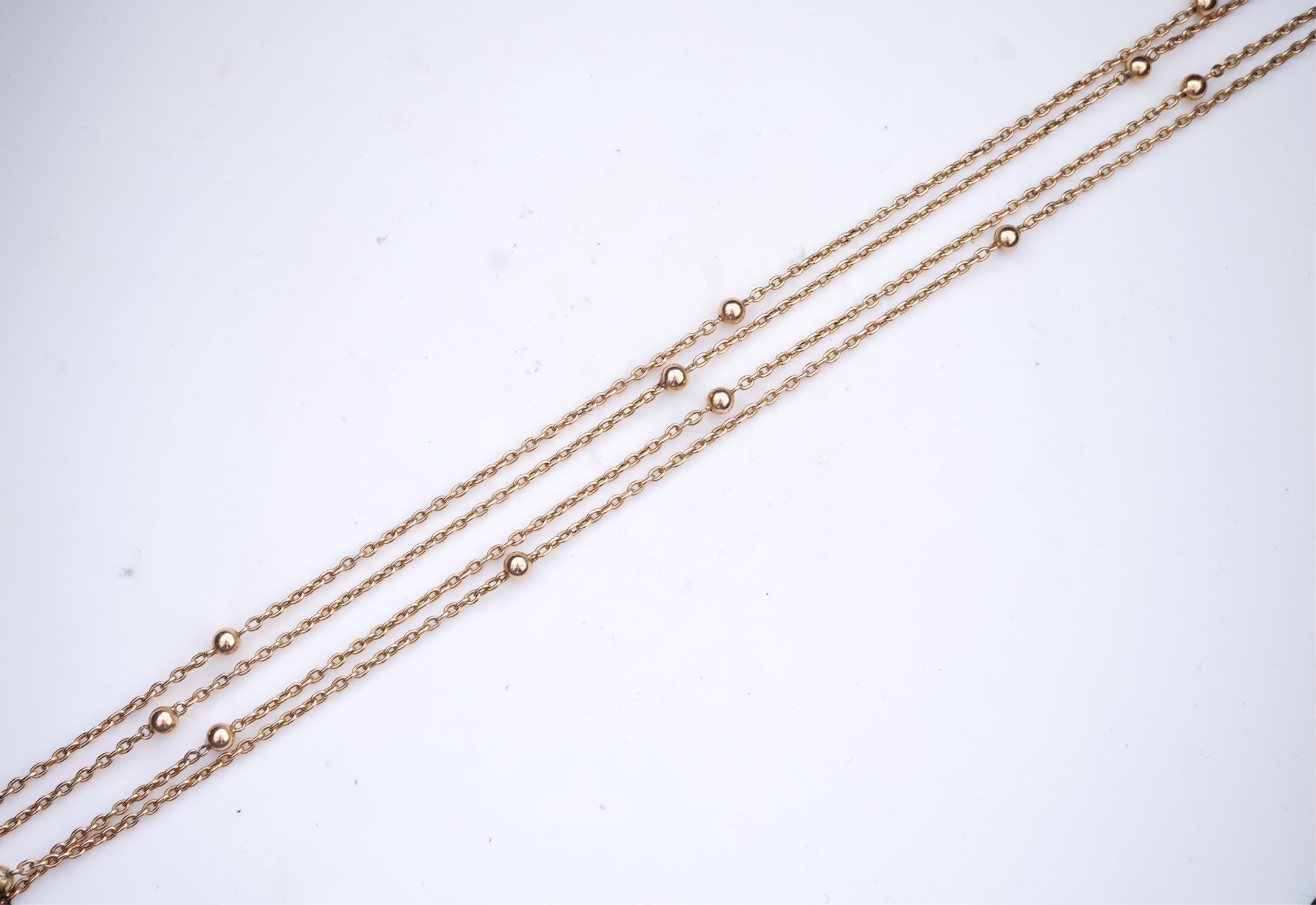 A gold long guard chain, early 20th century